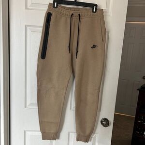 Nike tech fleece Tan Joggers with Black Trim - fray above knee